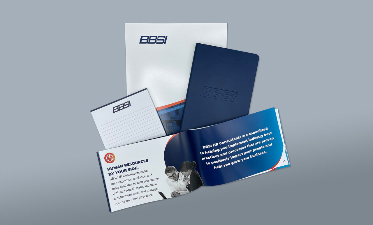 Example of Morel's print capabilities, showing a branded folder, notepad, notebook, and booklet for their client, BBSI.