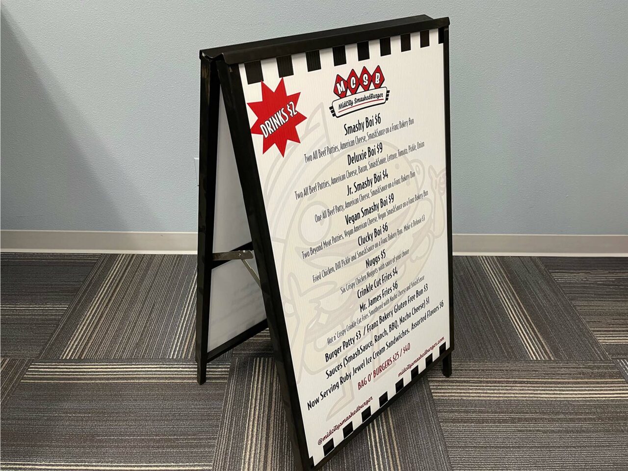 Example of Morel's wide format printing capabilities, showing a custom sandwich board for Smashburger