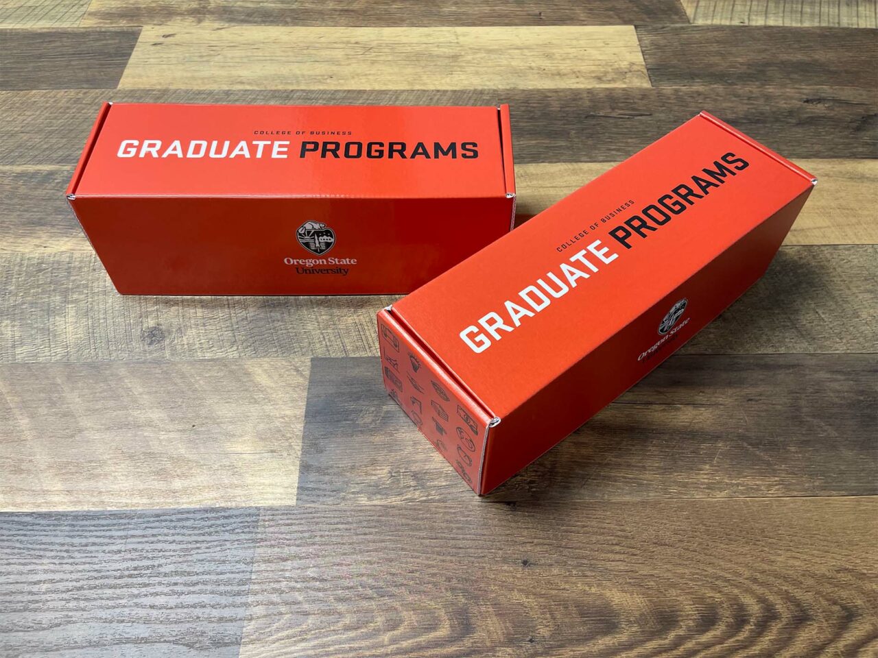 Example of Morel's packaging capabilities, showing a custom branded cardboard box for the OSU Graduate Program