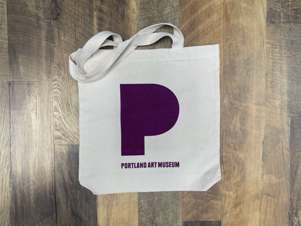 Example of Morel's promotional capabilities, showing a custom branded tote bag for the Portland Art Museum