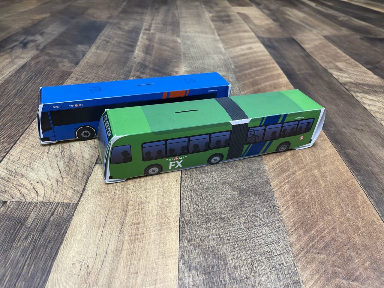 Example of Morel's packaging capabilities, showing custom branded box made to look like a TriMet bus