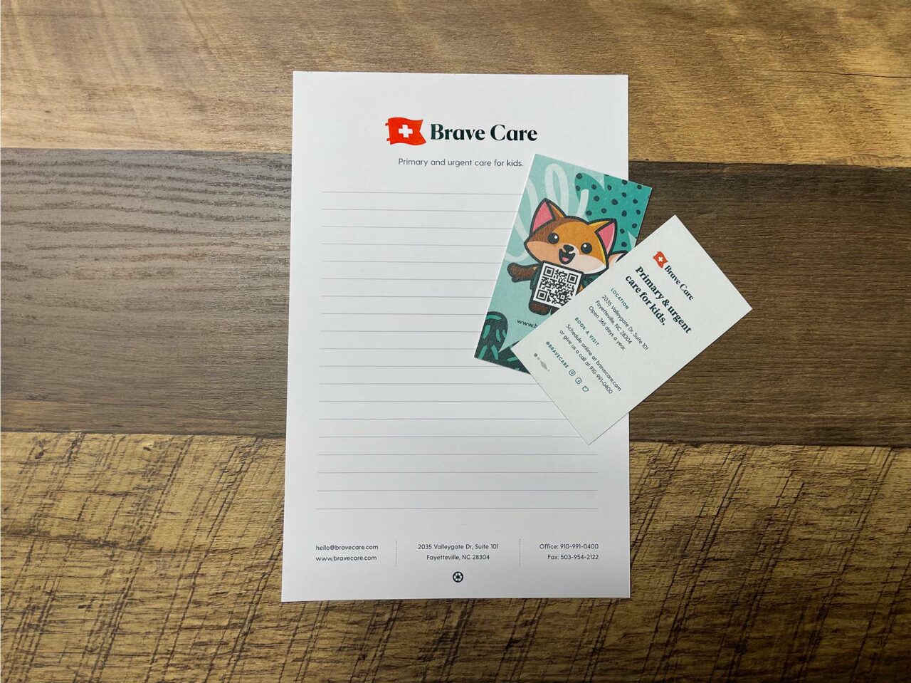 Example of Morel's print capabilities, showing a branded notepad and business cards for their client, Brave Care.