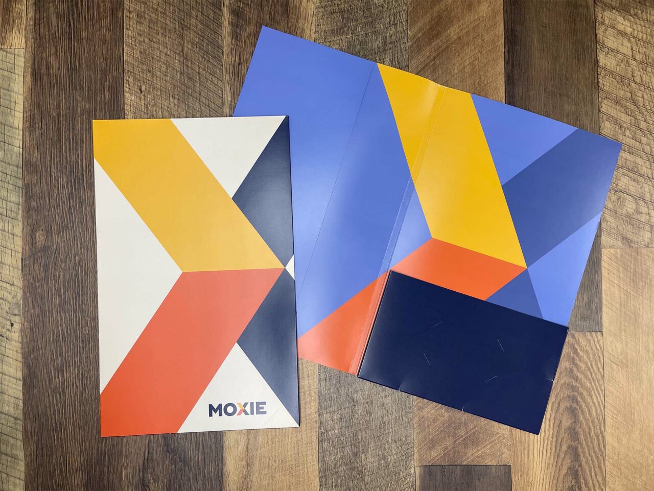Example of Morel's print and direct mail capabilities, showing a custom branded sales folder